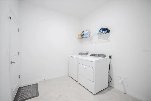 a view of a workspace with a window and a ceiling fan