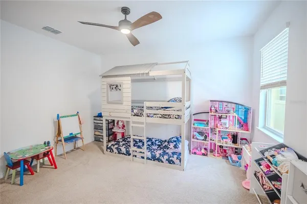 an aerial view of a house with a garden and swimming pool