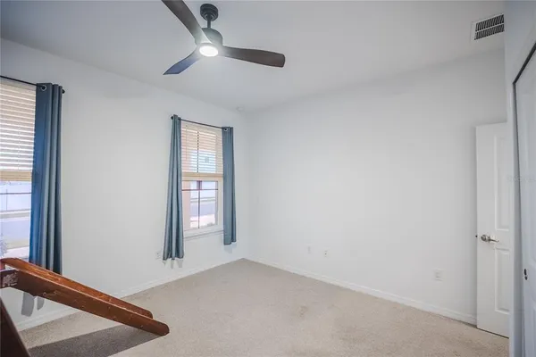 an aerial view of a house with a swimming pool
