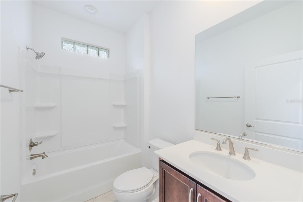 6200 Southwest 72nd Terrace Ocala, FL 34474 - Photo 53 of 70 a bathroom with a bathtub shower sink vanity and toilet