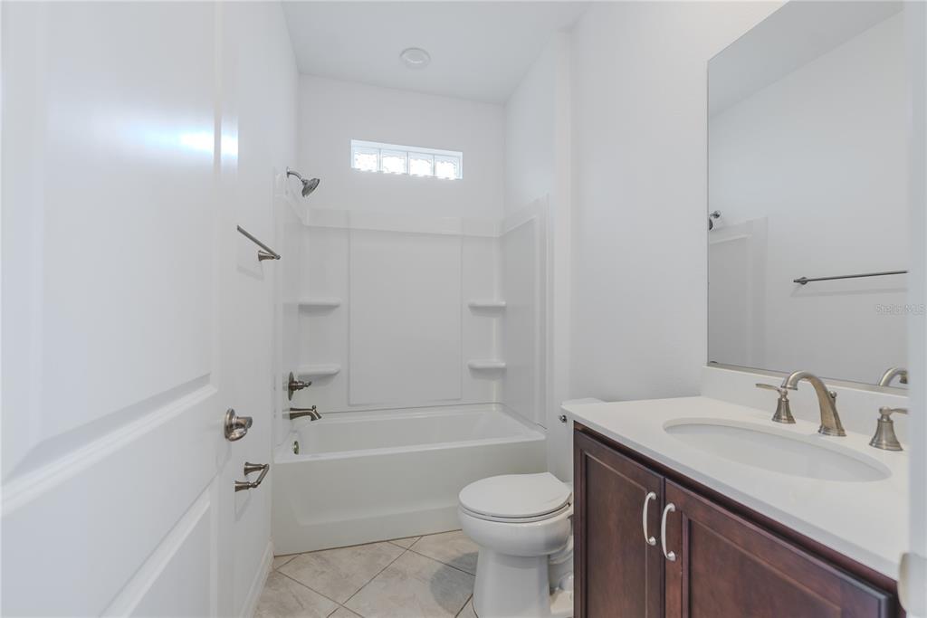 6200 Southwest 72nd Terrace Ocala, FL 34474 - Photo 54 of 70 a bathroom with a sink a toilet and shower