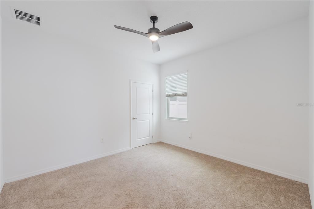 6200 Southwest 72nd Terrace Ocala, FL 34474 - Photo 57 of 70 an empty room with a ceiling fan and window