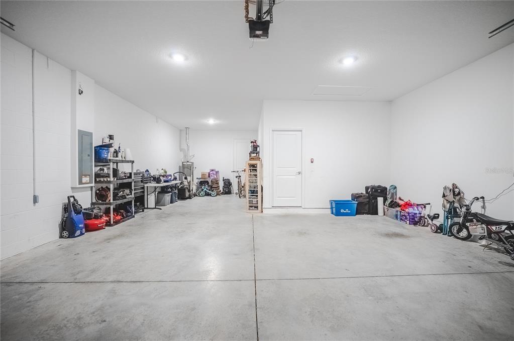 6200 Southwest 72nd Terrace Ocala, FL 34474 - Photo 61 of 70 a view of a garage with a bike and storage