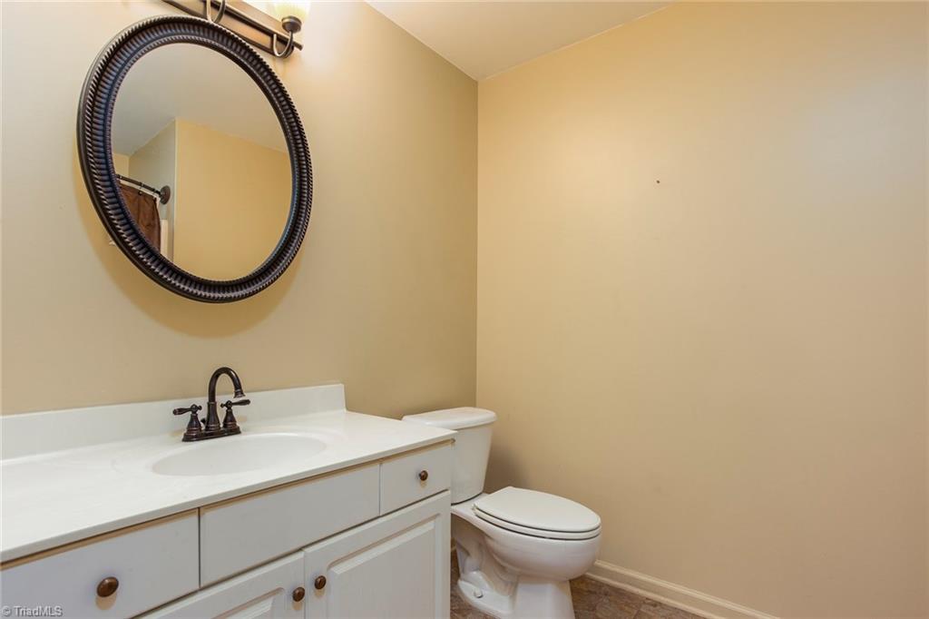 705 Old Mill Road High Point, NC 27265 - Photo 16 of 27 Main level hall bathroom has updated oil bronze hardware and light fixture.