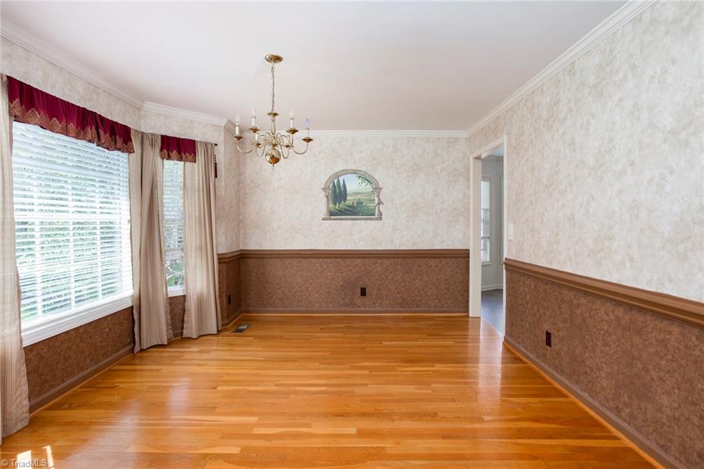 705 Old Mill Road High Point, NC 27265 - Photo 7 of 27 Dining room is framed with crown and chair molding.