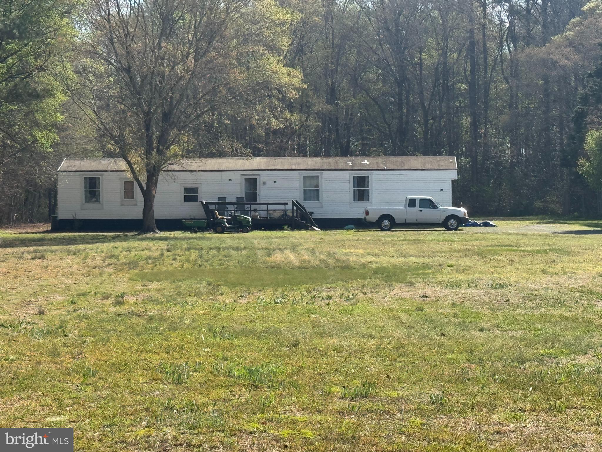 7941 Jones Hastings Road Parsonsburg, MD 21849 - Photo 1 of 1 a house with swimming pool in front of it