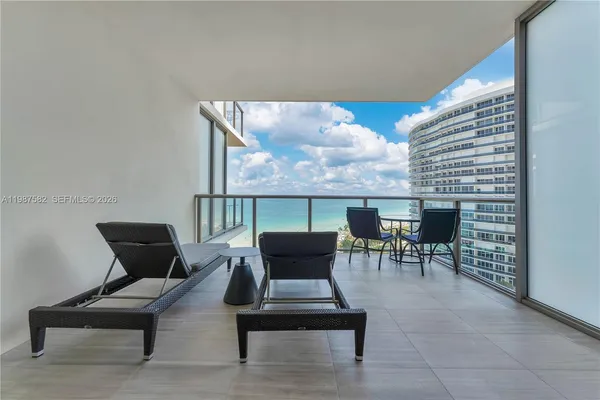 a patio with patio couch and table