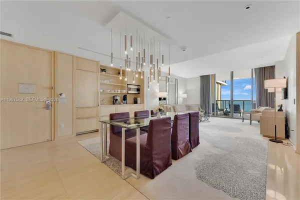 a large kitchen with a table and chairs