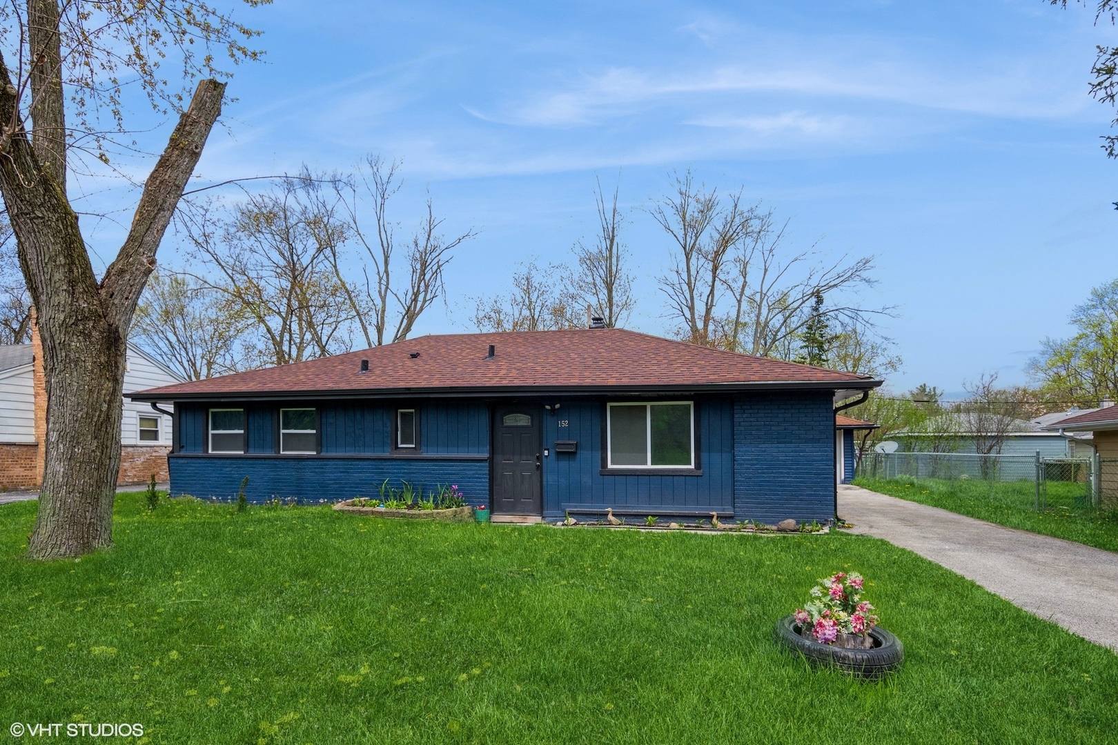 152 Monee Road Park Forest, IL 60466 - Photo 1 of 10 a front view of a house with a garden