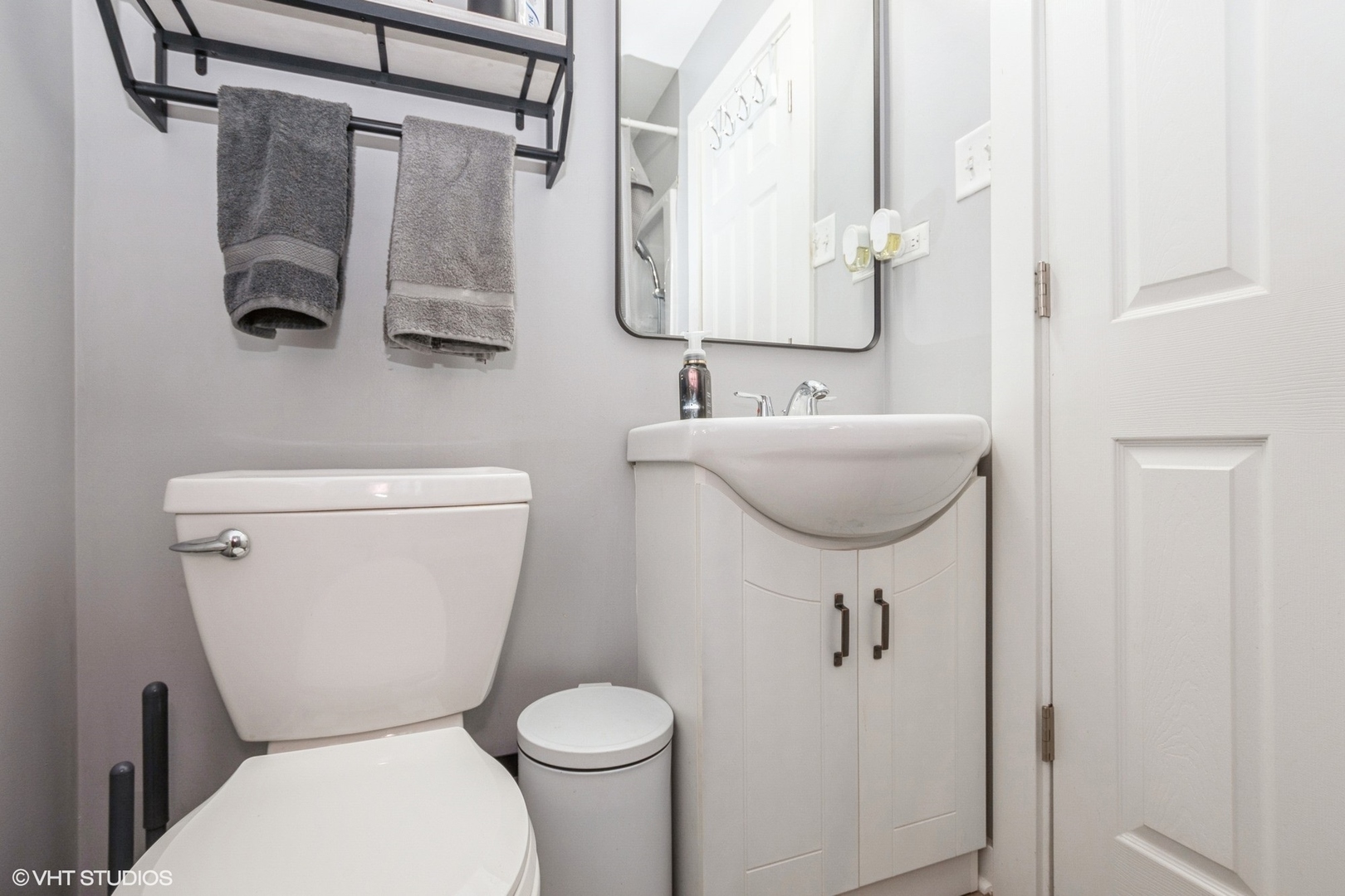 152 Monee Road Park Forest, IL 60466 - Photo 8 of 10 a bathroom with a toilet sink and mirror