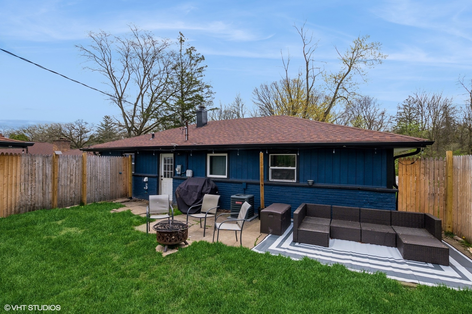 152 Monee Road Park Forest, IL 60466 - Photo 10 of 10 a view of a chair and table in backyard of the house