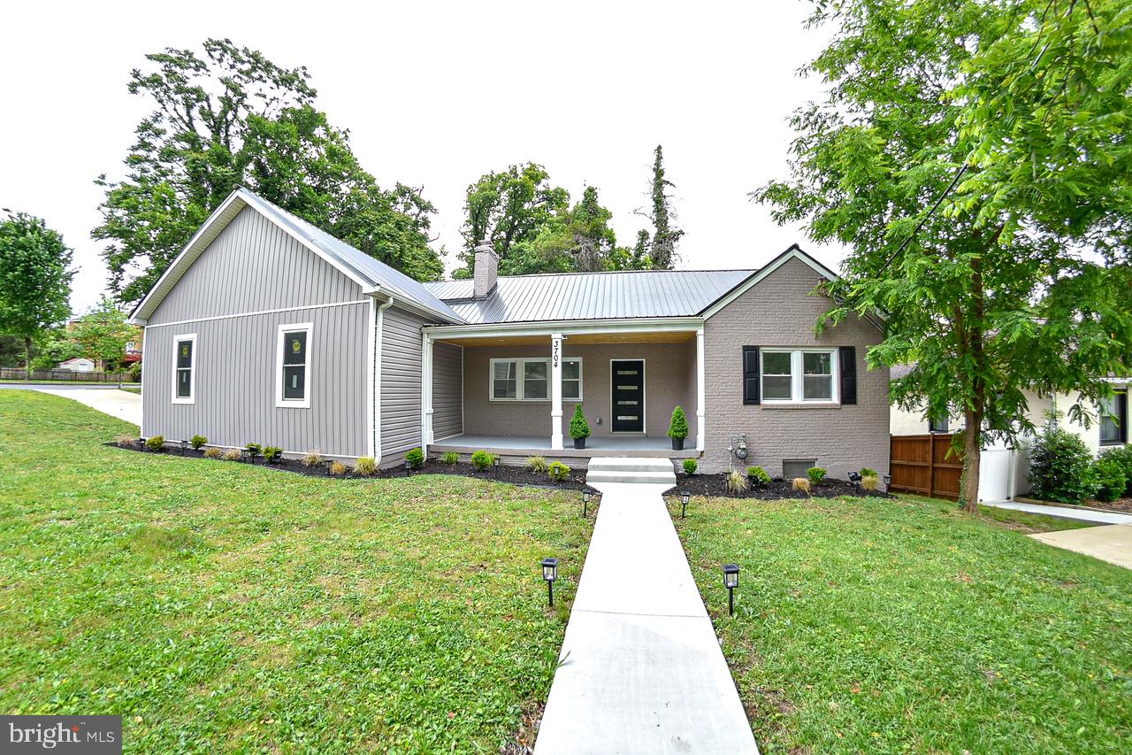 3704 Suitland Road Southeast Washington, DC 20020 - Photo 1 of 70 a front view of a house with yard