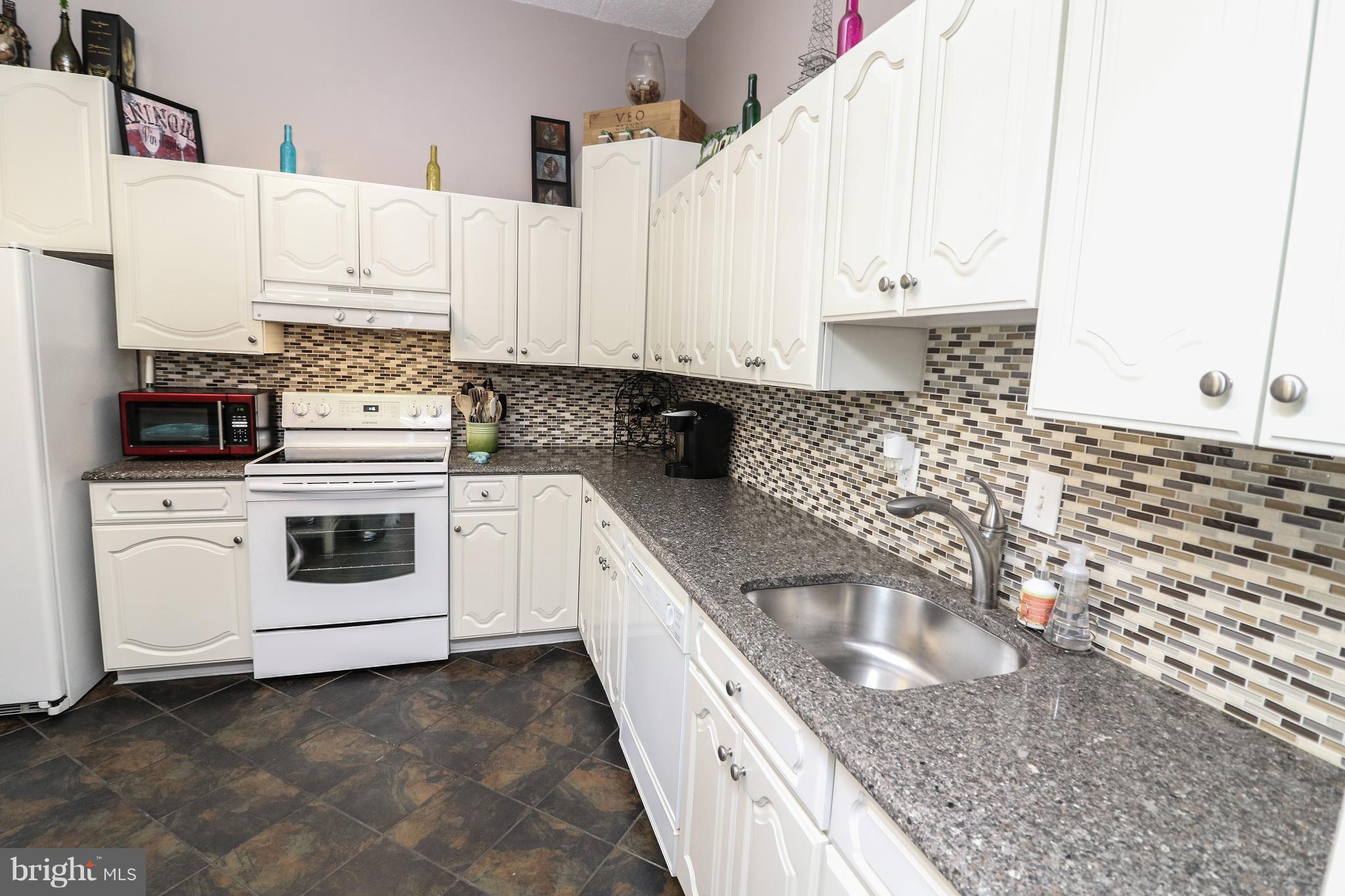 2114 Green Watch Way, Unit 101 Reston, VA 20191 - Photo 8 of 29 Tile Floor and Backsplash, and granite countertops