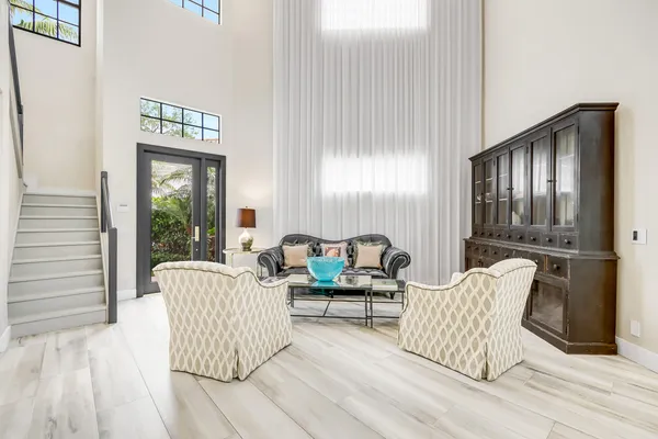 a living room with furniture and windows