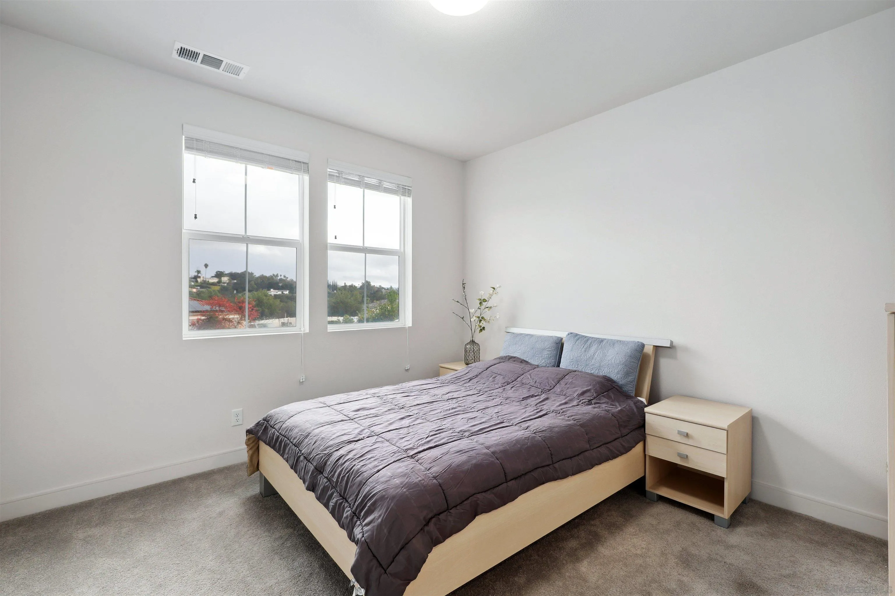 1294 Palomar Circle Escondido, CA 92027 - Photo 18 of 41 a bedroom with a bed and window