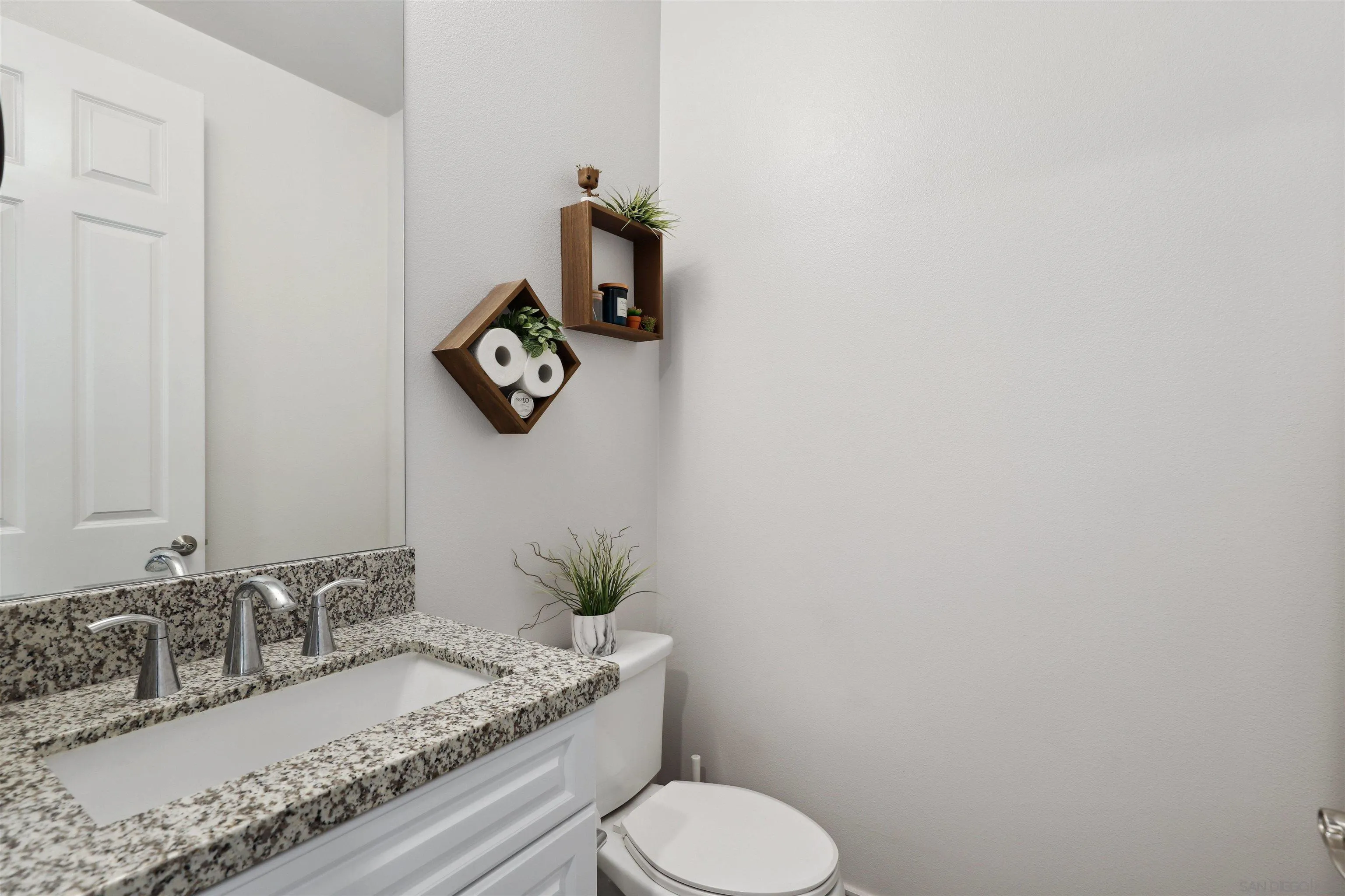 1294 Palomar Circle Escondido, CA 92027 - Photo 20 of 41 a bathroom with a granite countertop sink and a toilet