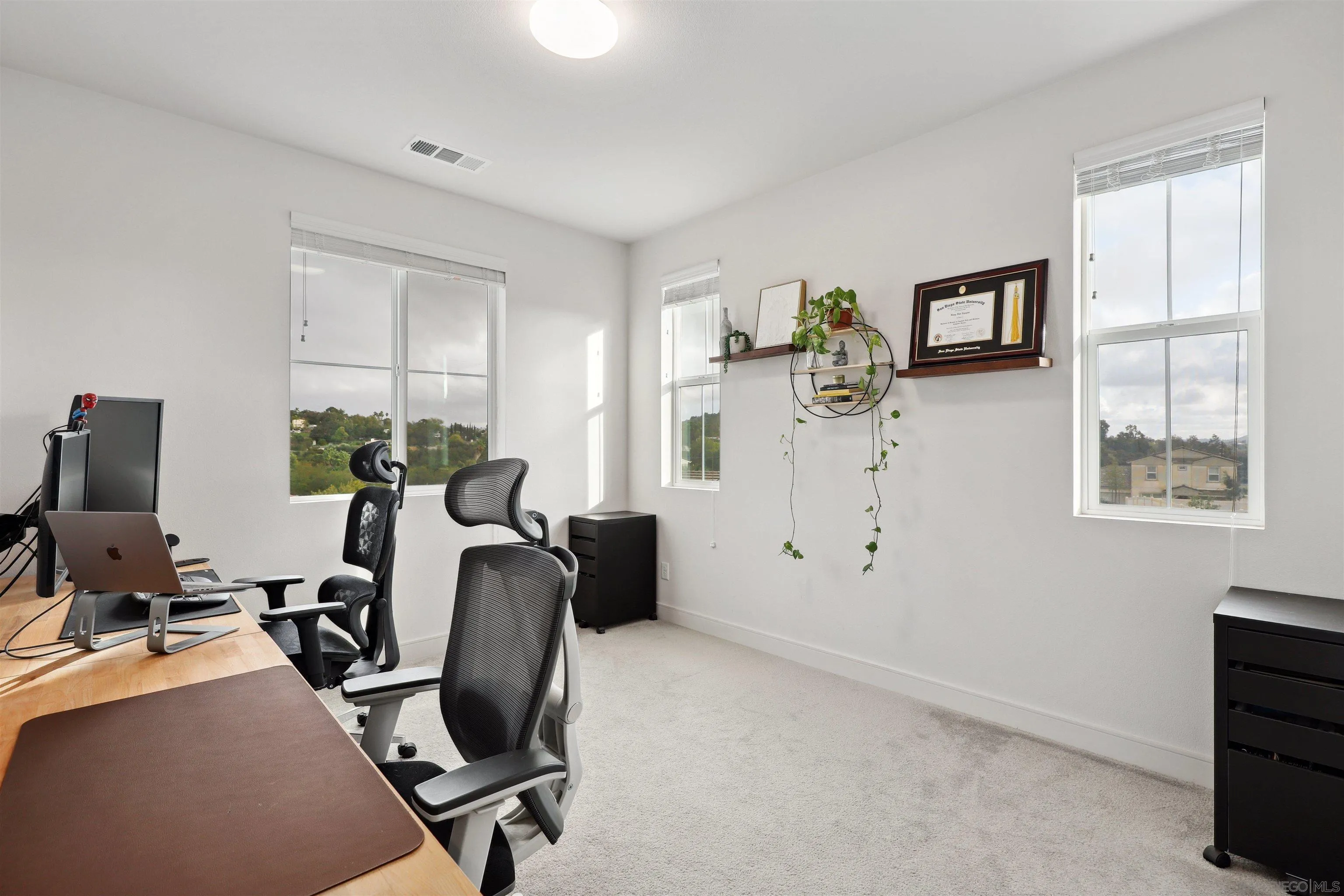 1294 Palomar Circle Escondido, CA 92027 - Photo 26 of 41 a view of a workspace with furniture and a window