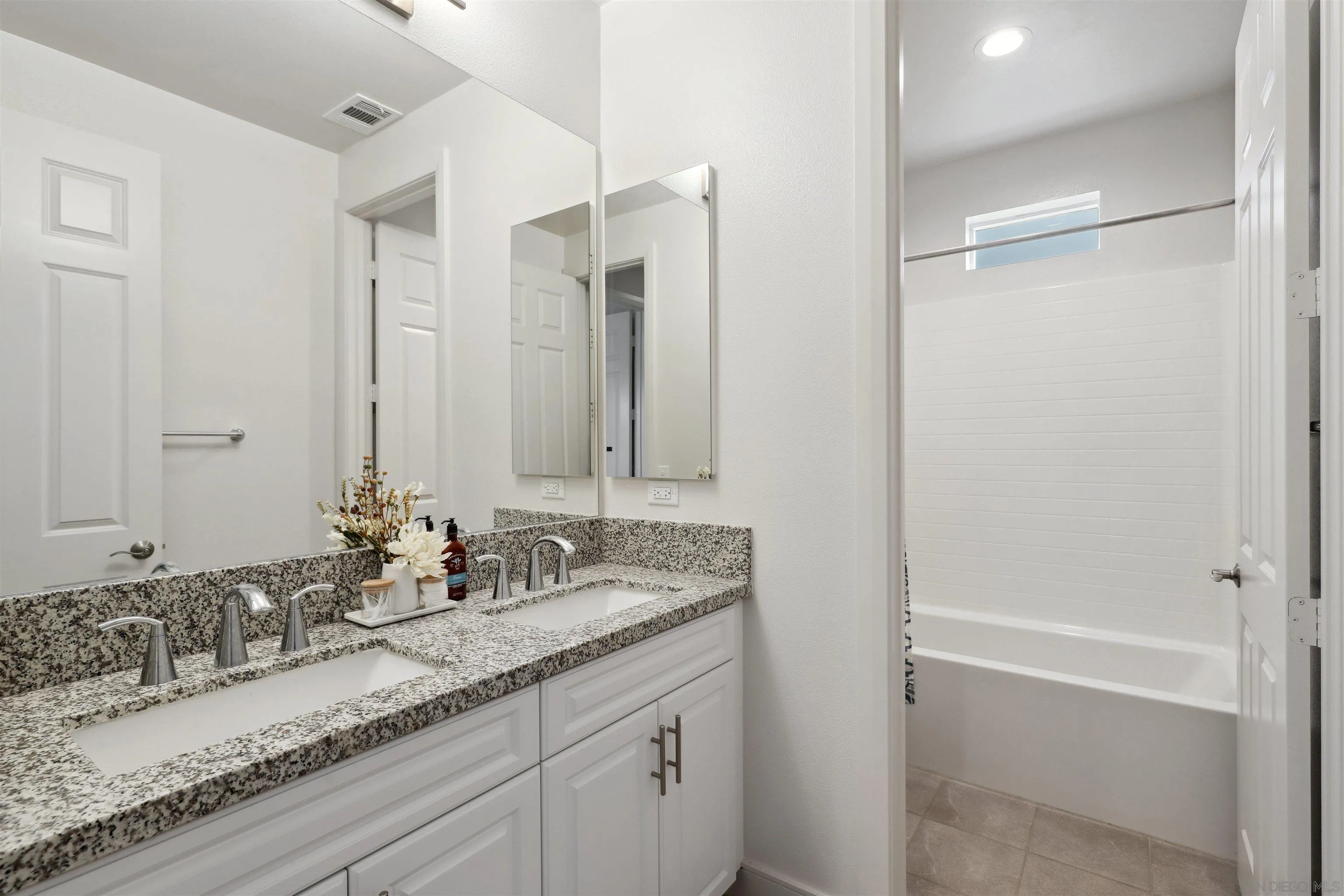 1294 Palomar Circle Escondido, CA 92027 - Photo 28 of 41 a bathroom with a granite countertop sink mirror and double