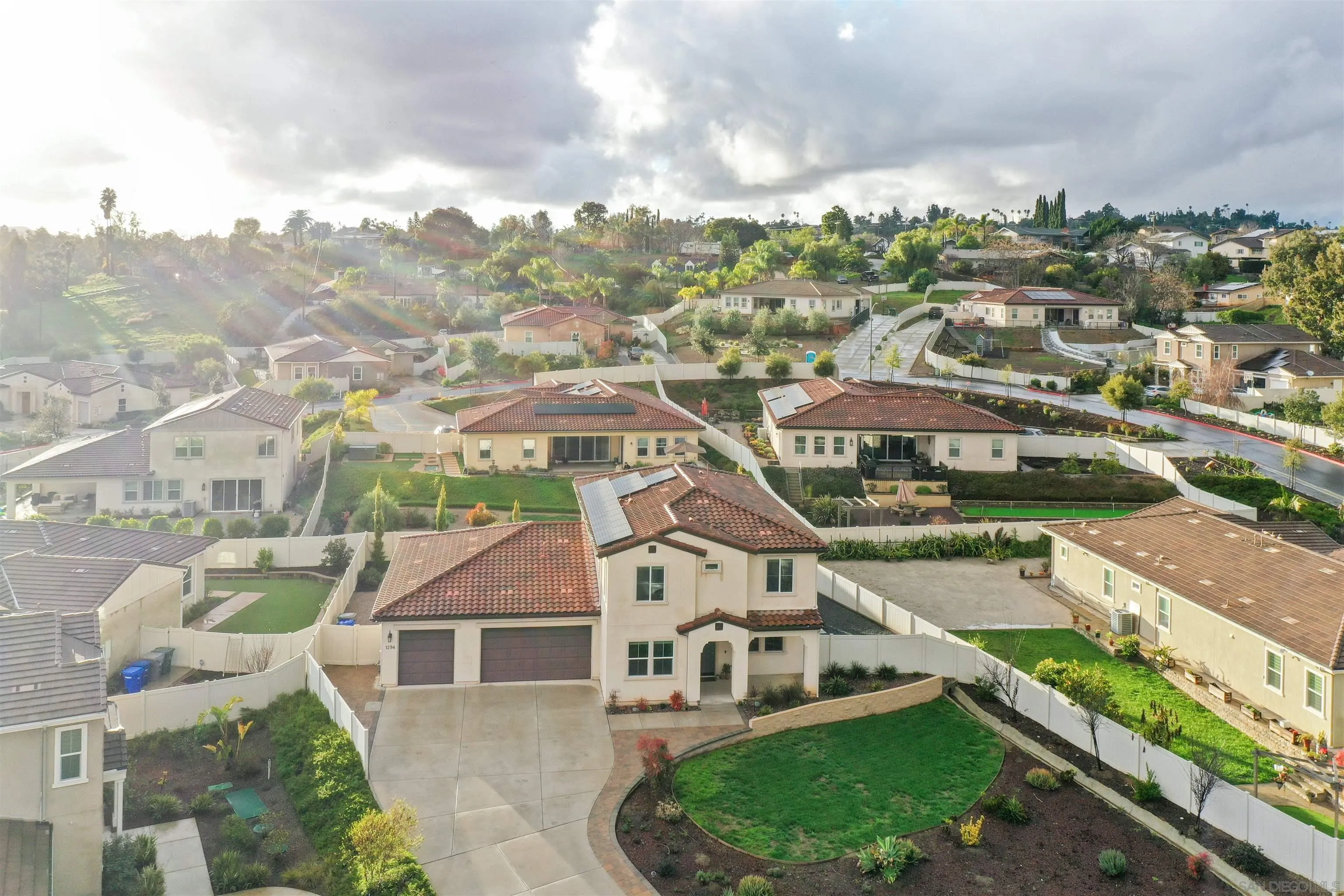 1294 Palomar Circle Escondido, CA 92027 - Photo 38 of 41 a view of a white house next to a yard