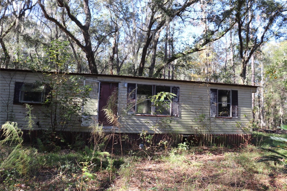 574154 Lessie Road Hilliard, FL 32046 - Photo 7 of 34 a backyard of a house with lots of green space