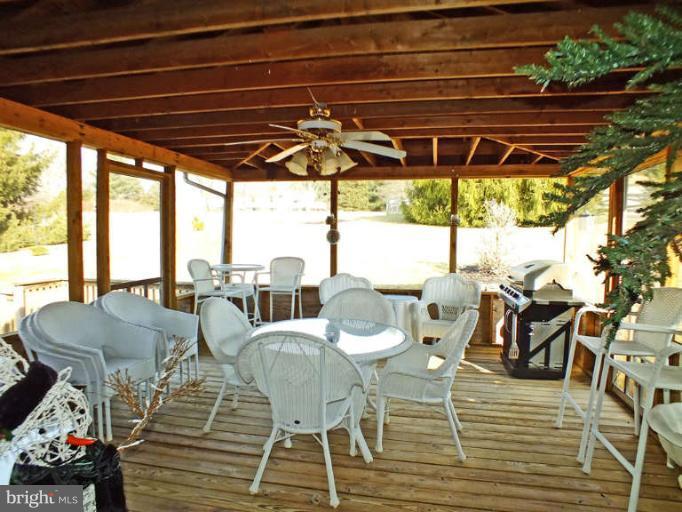 2914 Hoffman Mill Road Hampstead, MD 21074 - Photo 23 of 26 There is also a screened-in porch.