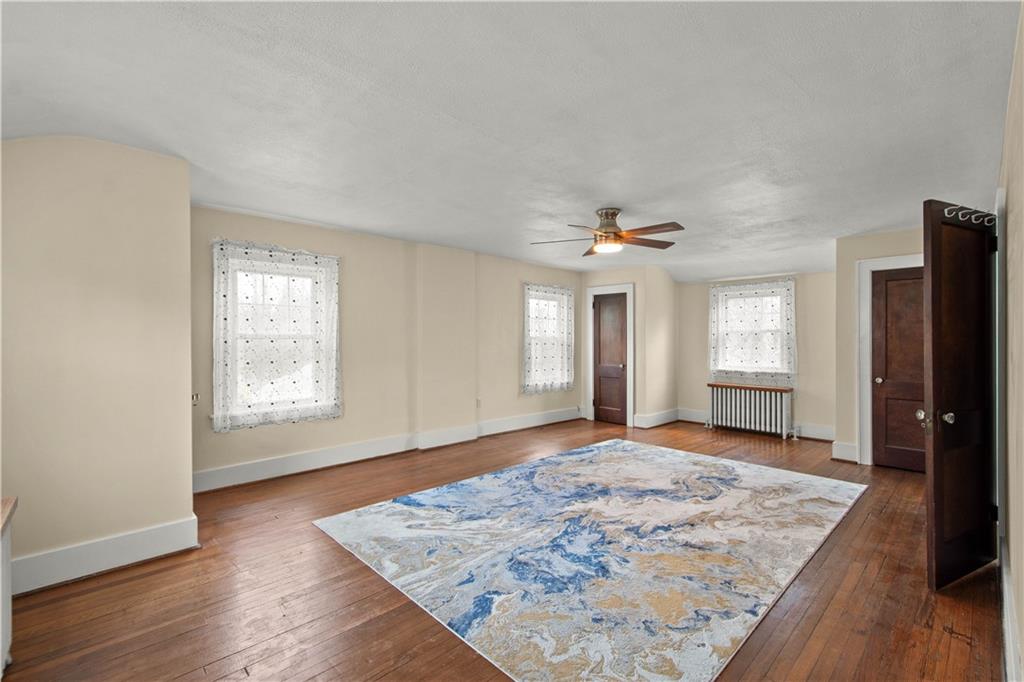 705 Walnut Street Crescent, PA 15046 - Photo 22 of 41 wooden floor in an empty room with a window