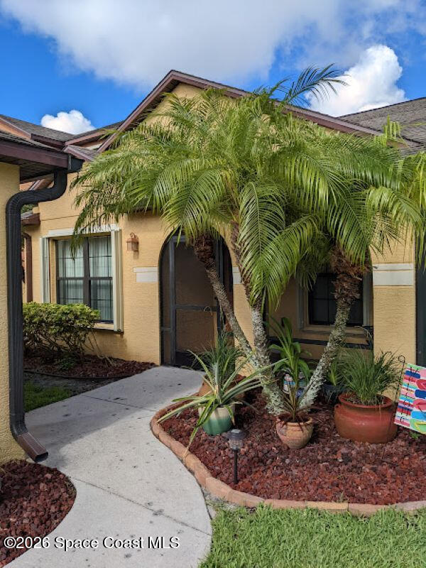 4530 Radiant Way, Unit 101 Melbourne, FL 32901 - Photo 1 of 26 a front view of a house with garden