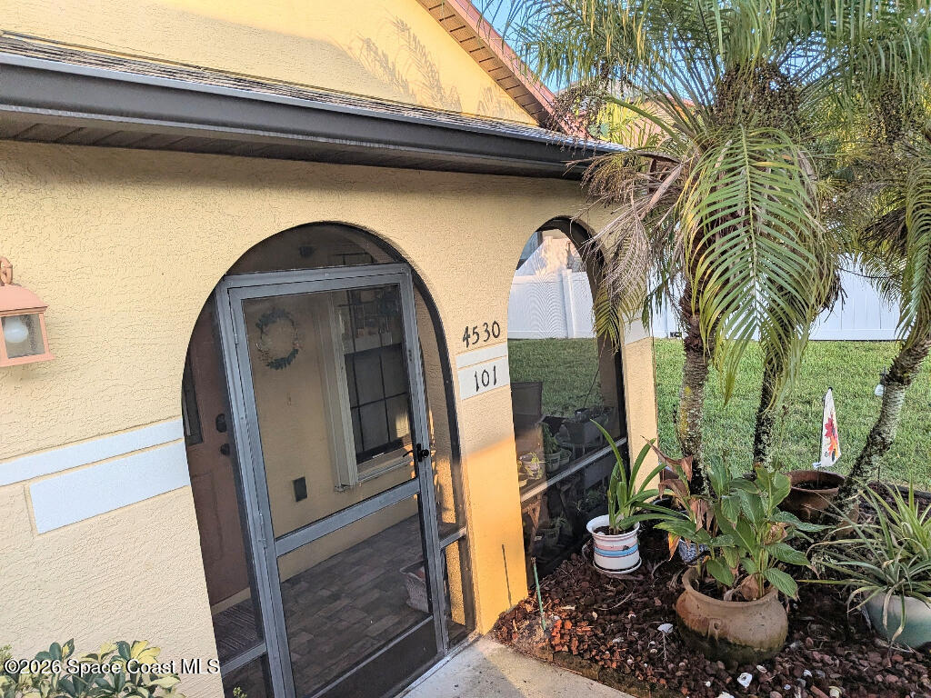 4530 Radiant Way, Unit 101 Melbourne, FL 32901 - Photo 12 of 26 a front view of a house with garden