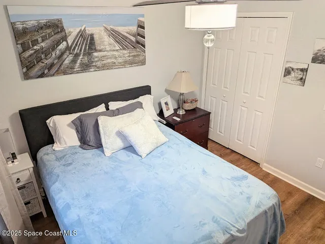 a view of swimming pool with outdoor seating and plants