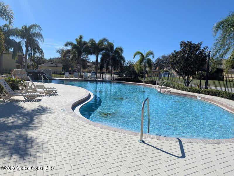 4530 Radiant Way, Unit 101 Melbourne, FL 32901 - Photo 14 of 26 a view of swimming pool with outdoor seating and plants