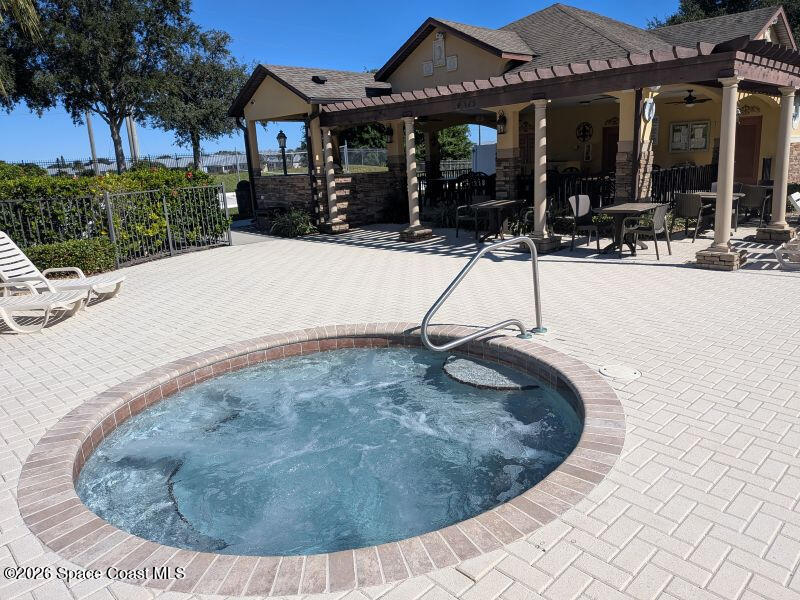 4530 Radiant Way, Unit 101 Melbourne, FL 32901 - Photo 15 of 26 a view of a house with a wooden fence