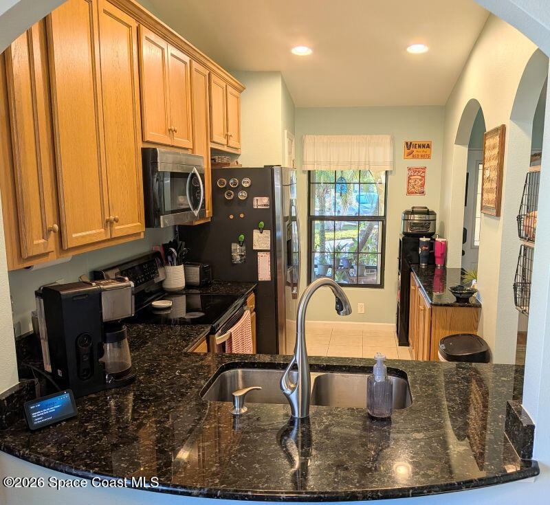 4530 Radiant Way, Unit 101 Melbourne, FL 32901 - Photo 5 of 26 a view of a living room and dining room