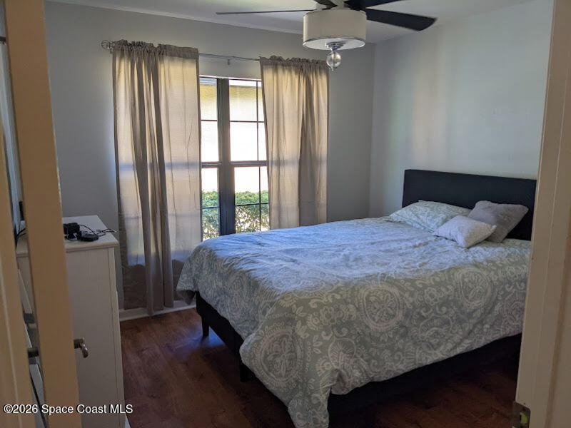 4530 Radiant Way, Unit 101 Melbourne, FL 32901 - Photo 6 of 26 a bedroom with a bed and a window