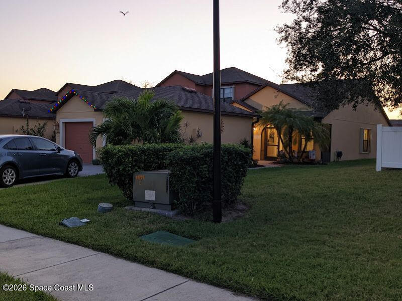 4530 Radiant Way, Unit 101 Melbourne, FL 32901 - Photo 7 of 26 a house view with a garden space