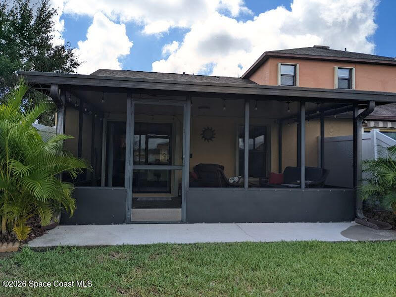 4530 Radiant Way, Unit 101 Melbourne, FL 32901 - Photo 9 of 26 a view of a house with a small yard and plants
