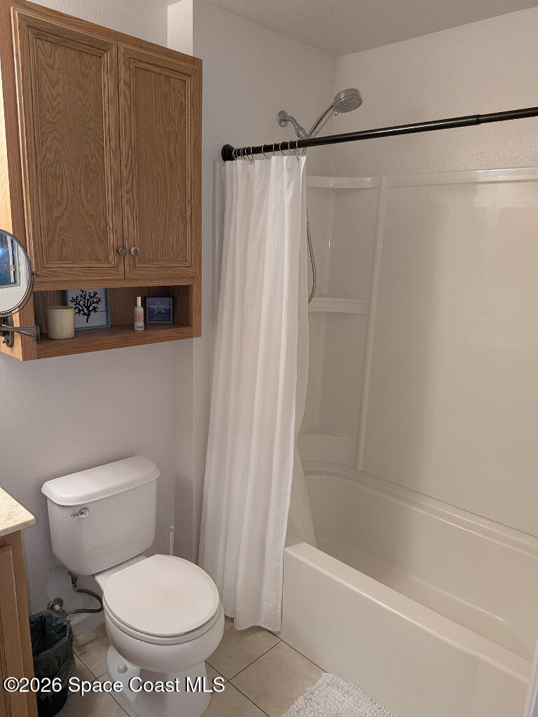 4530 Radiant Way, Unit 101 Melbourne, FL 32901 - Photo 10 of 26 a bathroom with a toilet and a shower