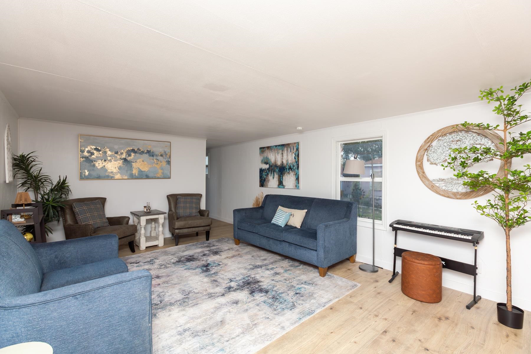424 32 Road, Unit 112 Clifton, CO 81520 - Photo 6 of 41 a living room with furniture a fireplace and a potted plant