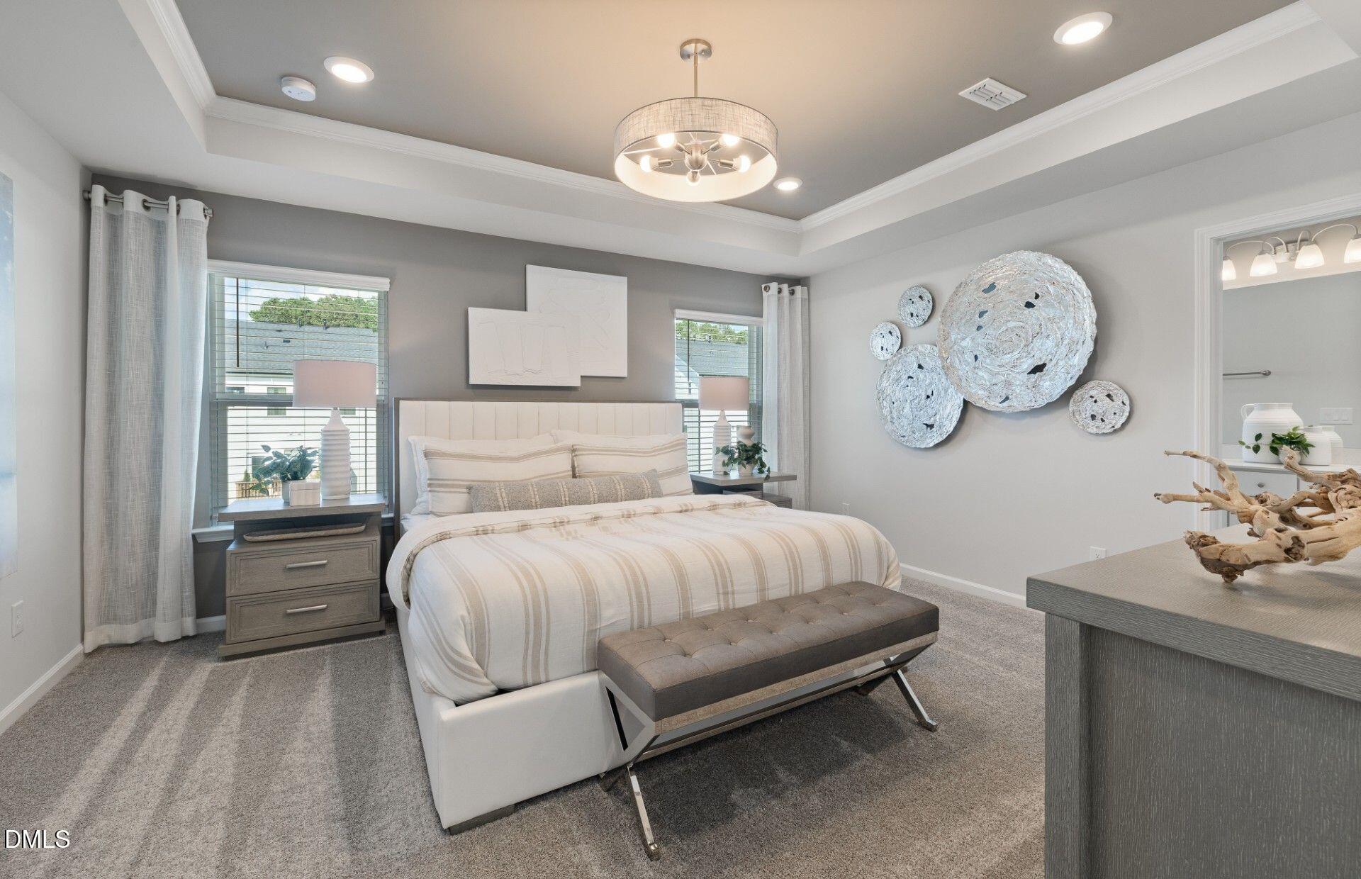 2544 Olive Chapel Road Apex, NC 27502 - Photo 10 of 32 a bed room with a bed and a clock