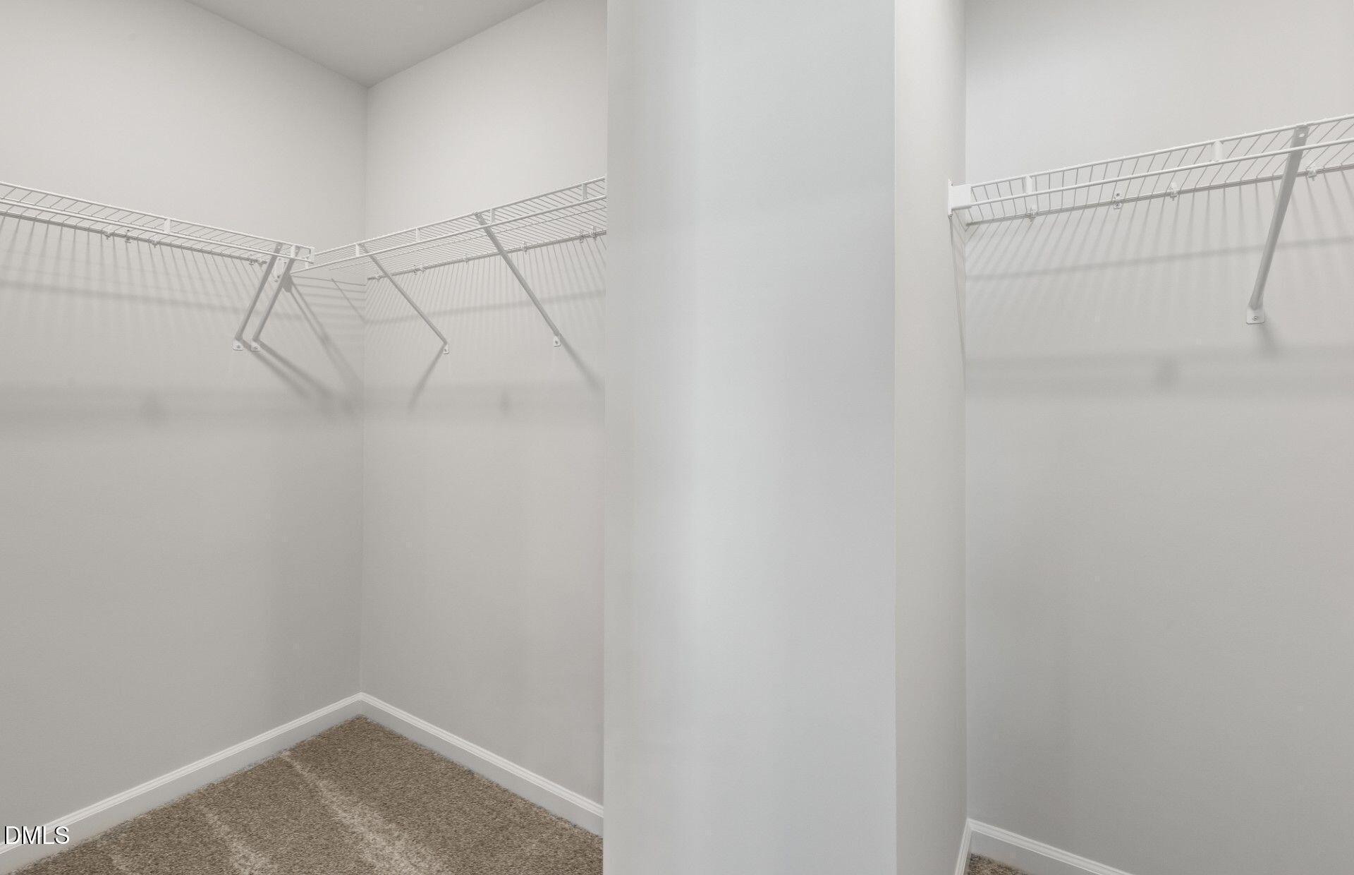 2544 Olive Chapel Road Apex, NC 27502 - Photo 13 of 32 a view of a room with racks on the wall