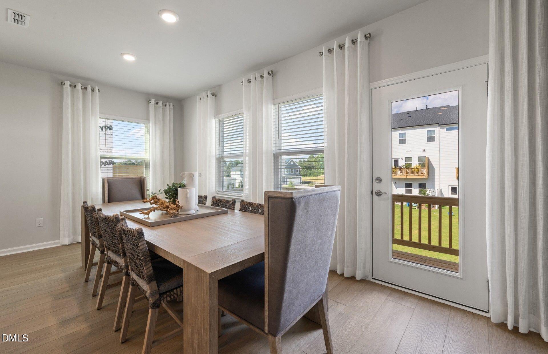 2544 Olive Chapel Road Apex, NC 27502 - Photo 6 of 32 a view of a dining room with furniture and window
