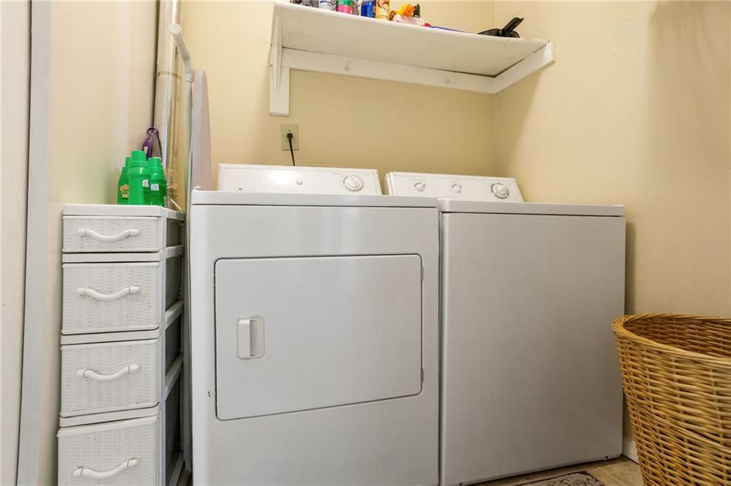 306 Countryside Place Smyrna, GA 30080 - Photo 19 of 35 a utility room with dryer and washer