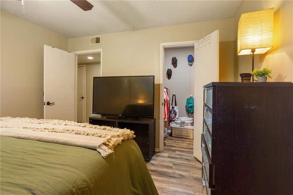 306 Countryside Place Smyrna, GA 30080 - Photo 21 of 35 a bedroom with a bed and a flat screen tv