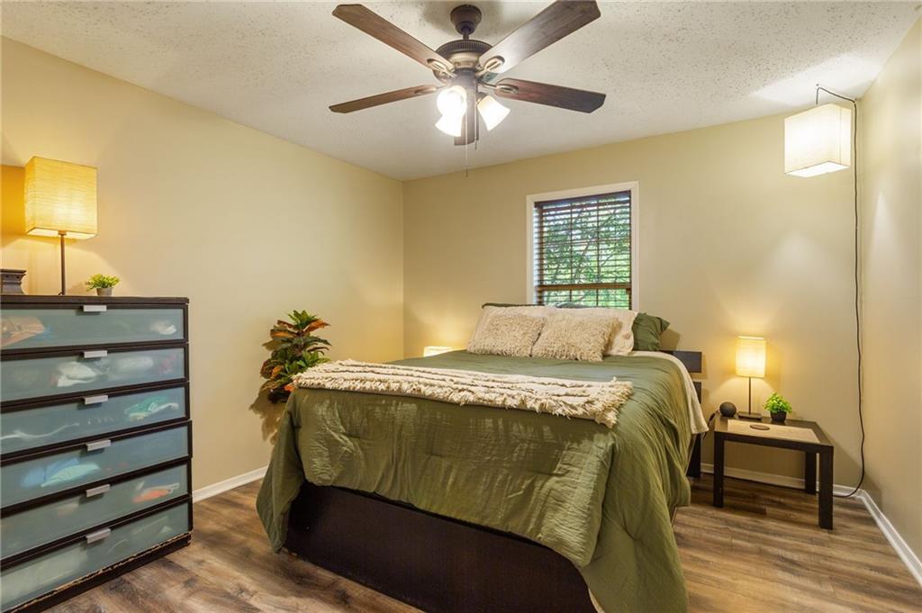 306 Countryside Place Smyrna, GA 30080 - Photo 5 of 35 a bedroom with a bed and a chandelier