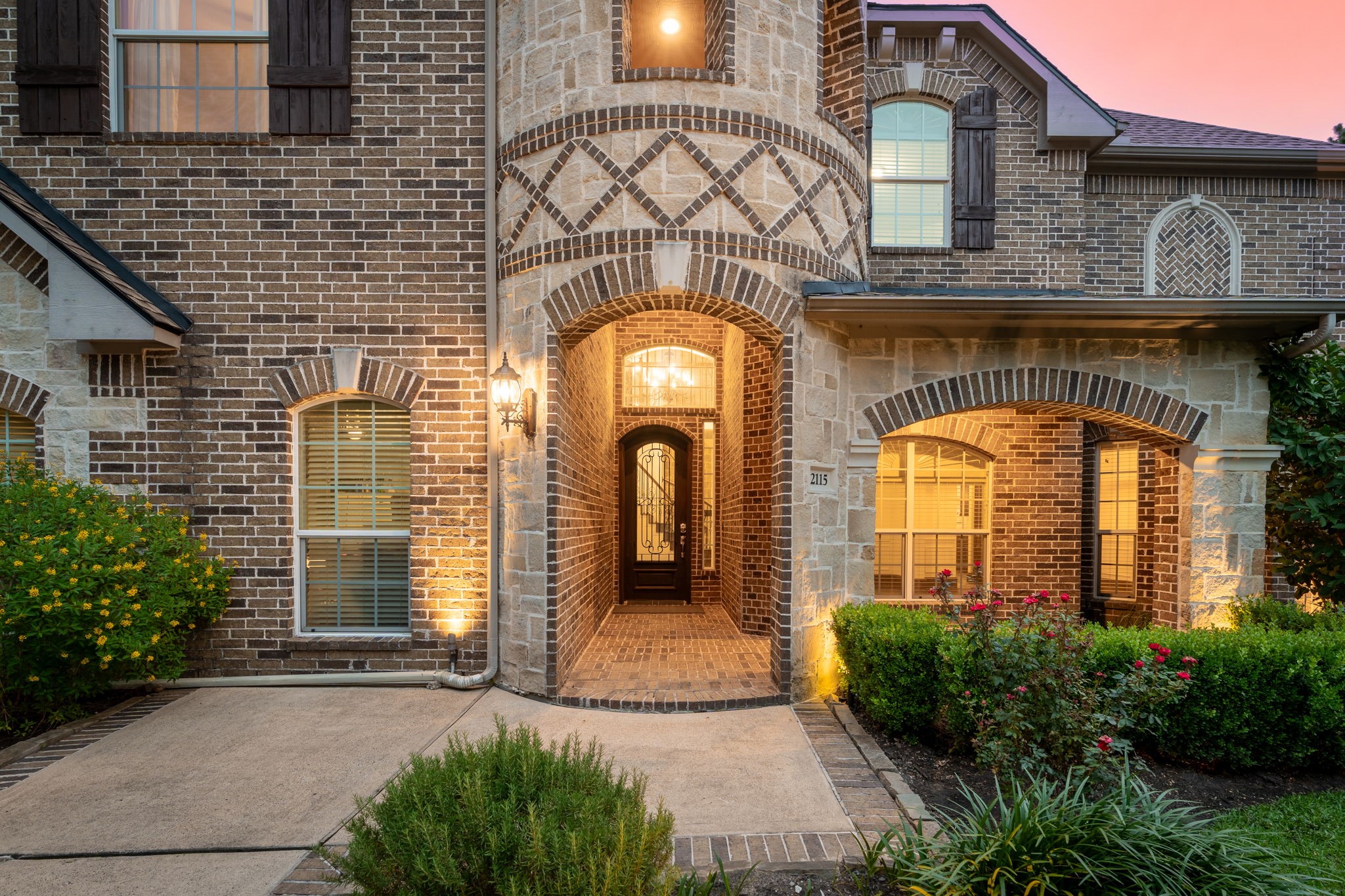 2115 Graystone Ridge Drive Conroe, TX 77304 - Photo 2 of 47 Inviting front entrance with charming architectural details and a spacious porch perfect for greeting guests.