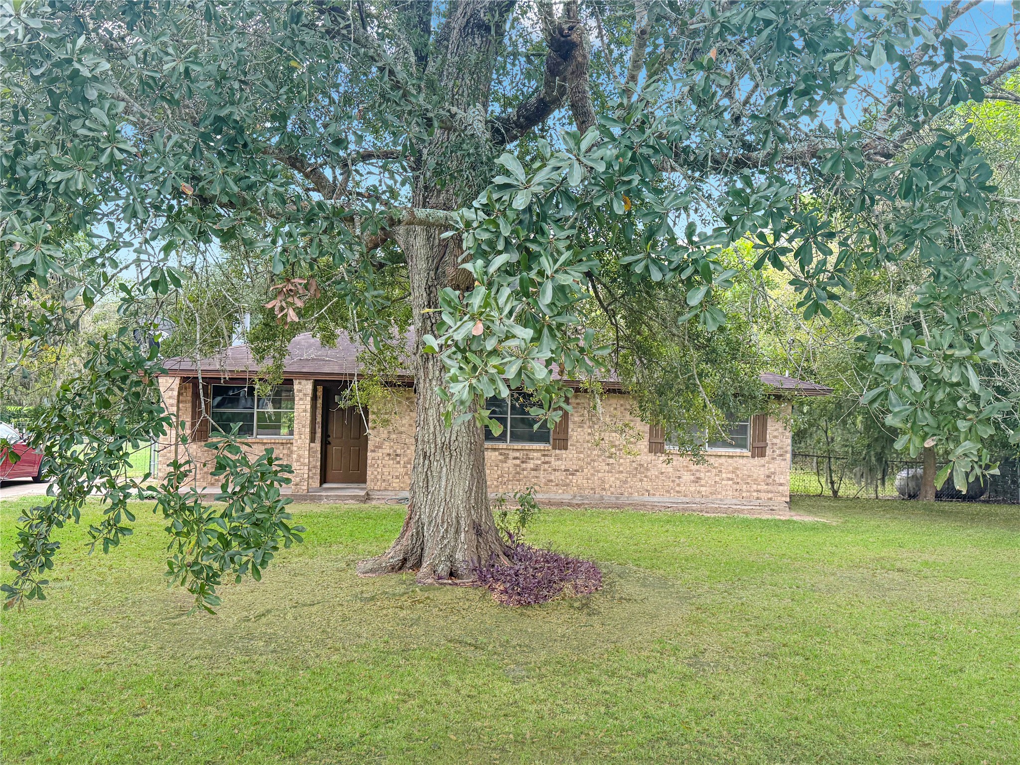 122 County Road 725 Sweeny, TX 77480 - Photo 13 of 13 a front view of a house with garden