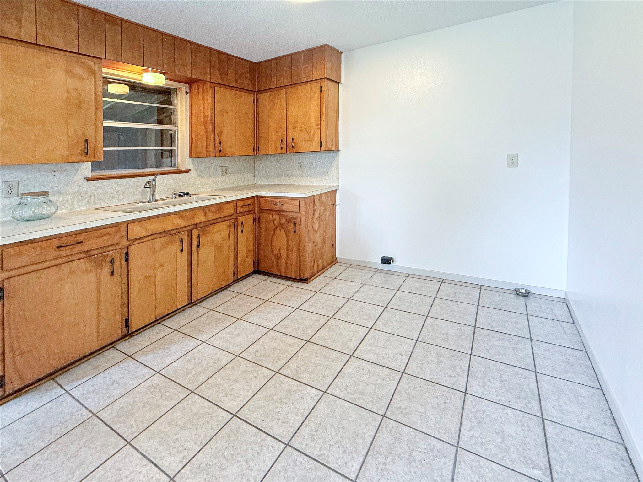 122 County Road 725 Sweeny, TX 77480 - Photo 5 of 13 a kitchen with a sink and cabinets