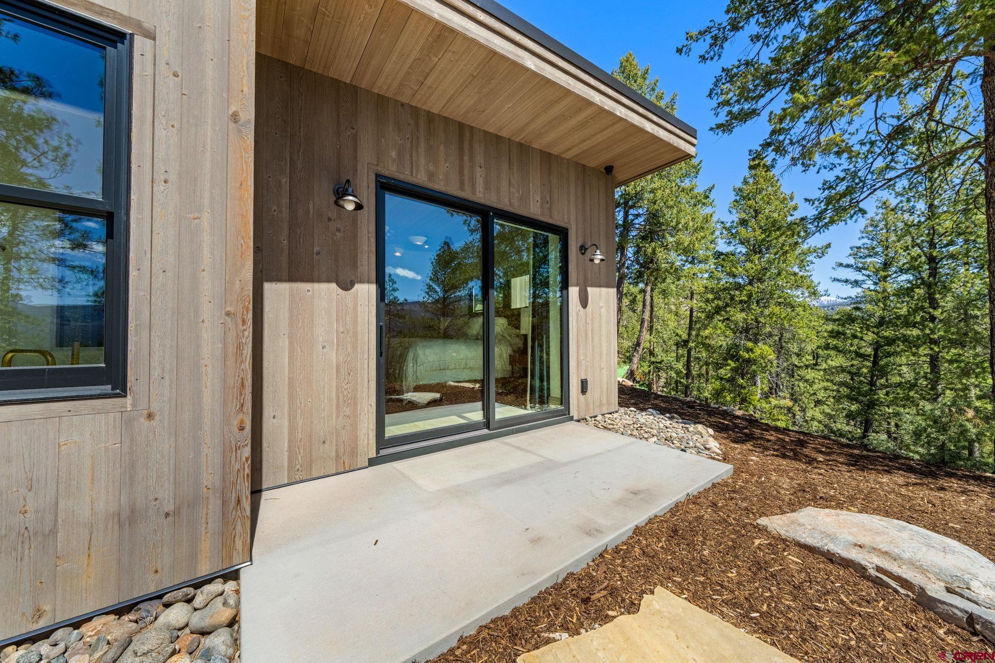 49 Bluff Drive Durango, CO 81301 - Photo 12 of 45 a view of backyard with plants and outdoor seating
