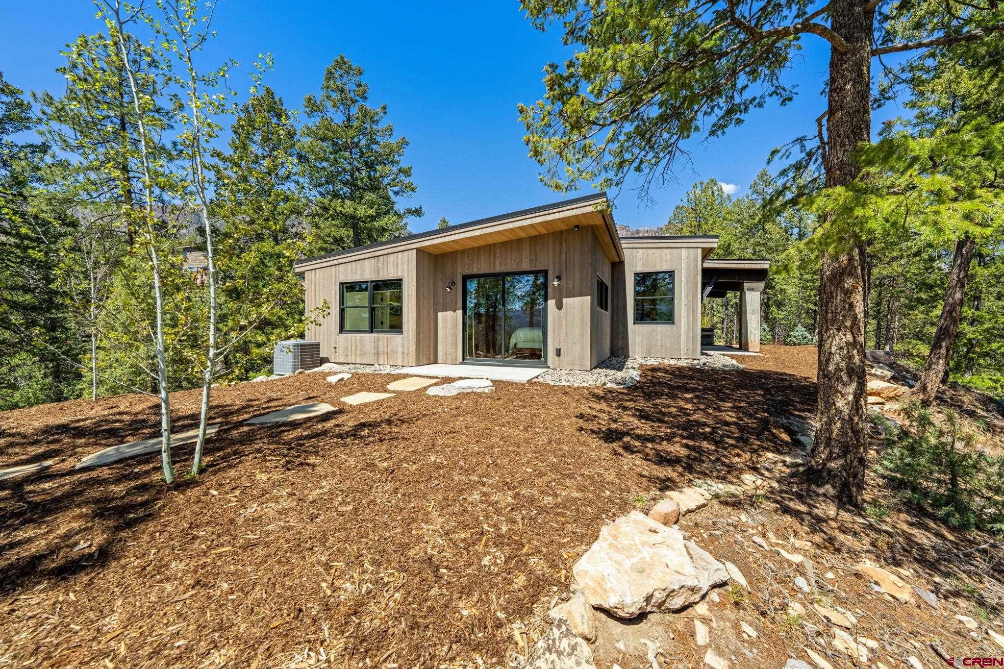 49 Bluff Drive Durango, CO 81301 - Photo 17 of 45 a view of a house with a yard