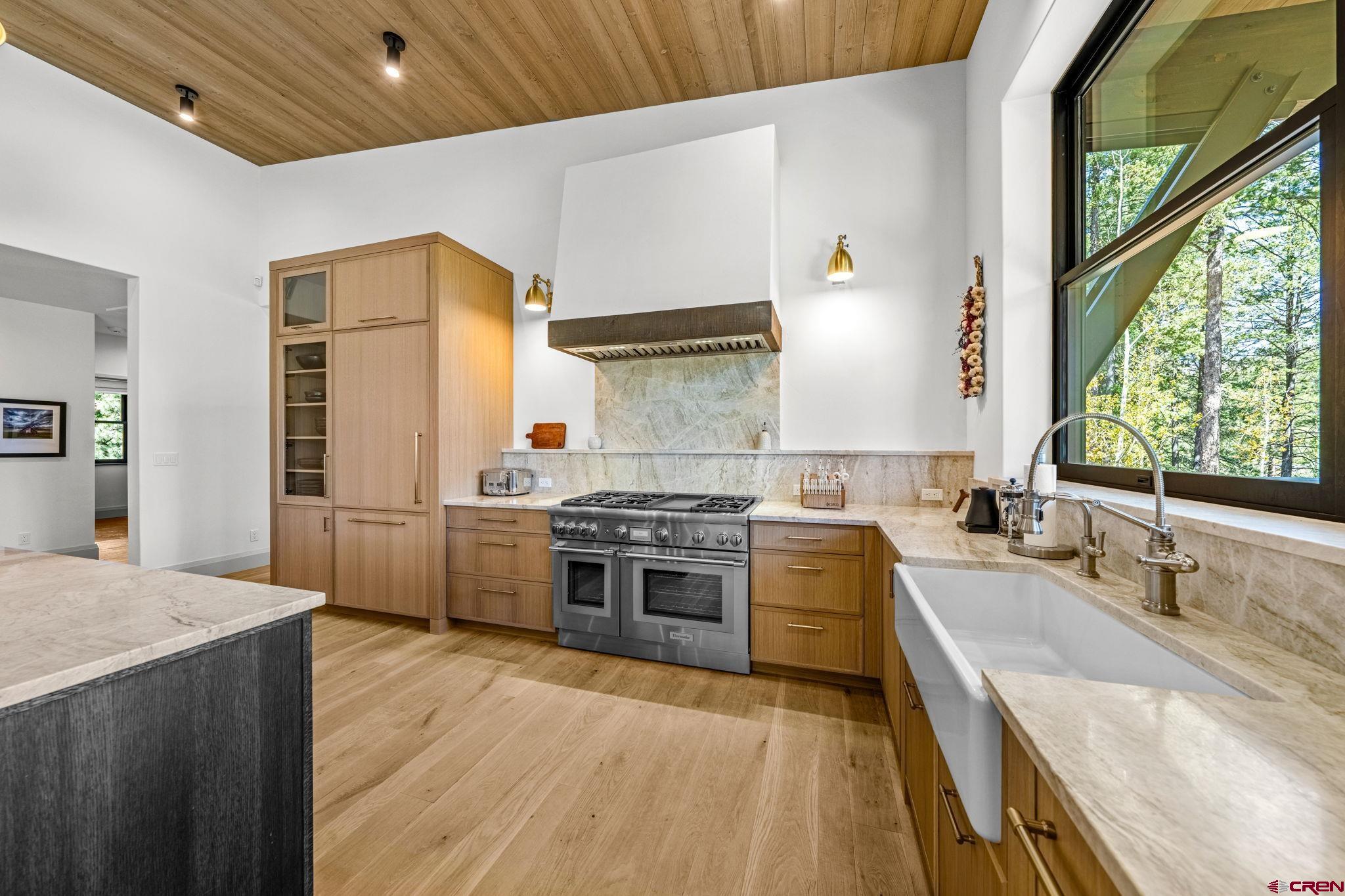 49 Bluff Drive Durango, CO 81301 - Photo 20 of 45 a kitchen with stainless steel appliances granite countertop a sink stove and refrigerator