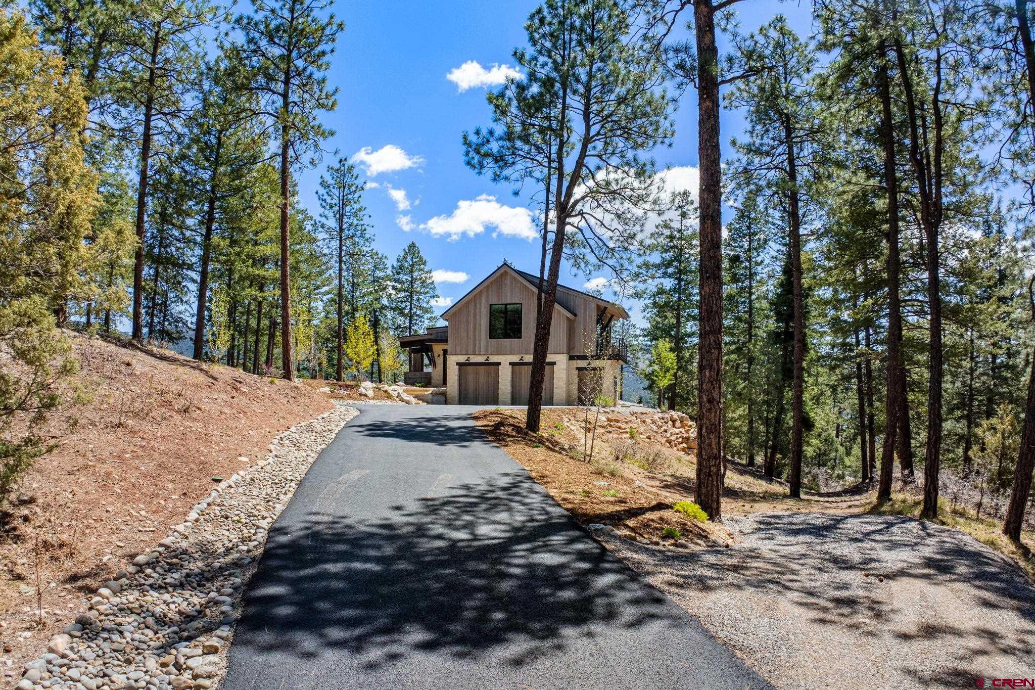 49 Bluff Drive Durango, CO 81301 - Photo 2 of 45 a dirt road with trees in front of it